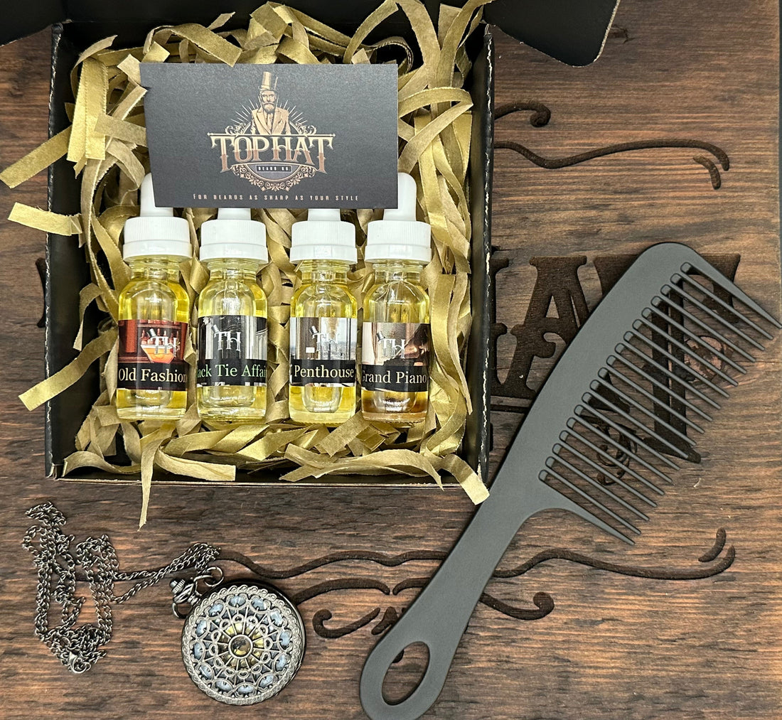 TopHat beard oil sample bottles in a gift box beside a comb and pocket watch on a wooden surface.TopHat beard oil sample bottles in a gift box beside a comb and pocket watch on a wooden surface.